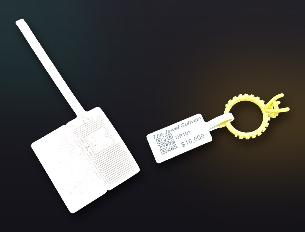 RFID jewelry label: the RFID inlay and a printed The Jewel Software price tag with QR code on a ring